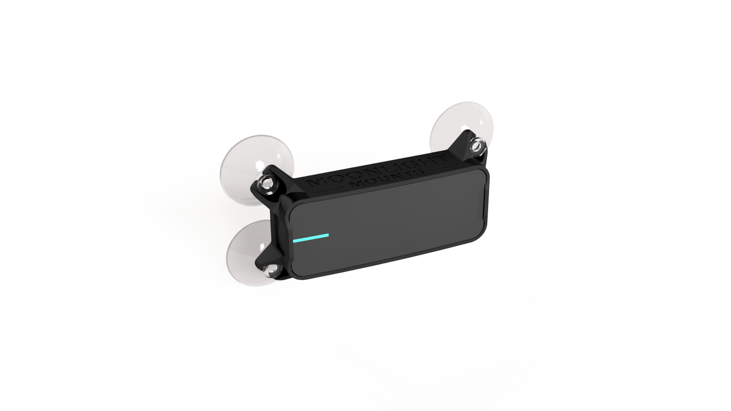 Dragy GPS meter suction cup mount, angled view of the Dragy in its holder with four clear suction cups