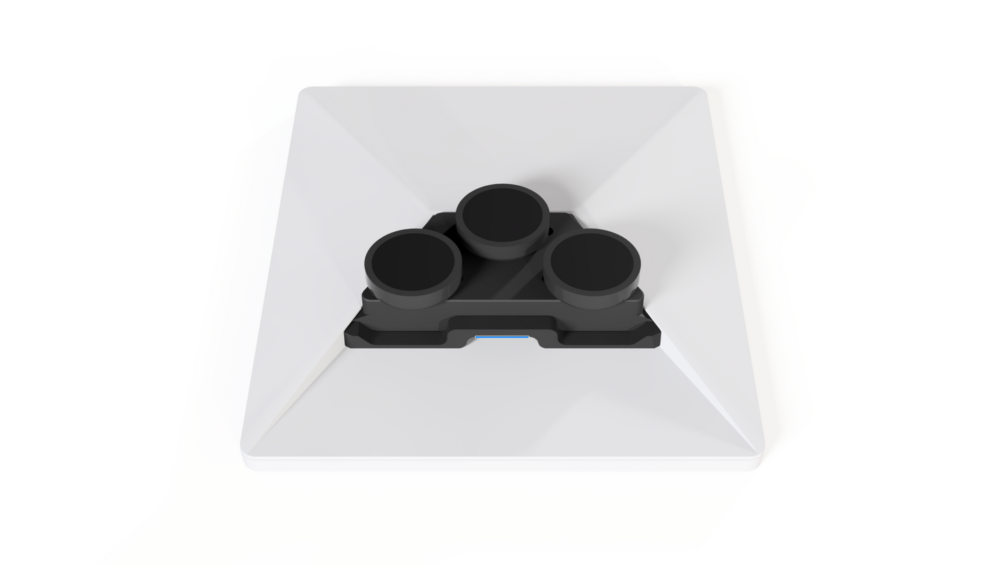 Top-down view of a Starlink Mini lying face down, showing the hybrid mount's three magnets